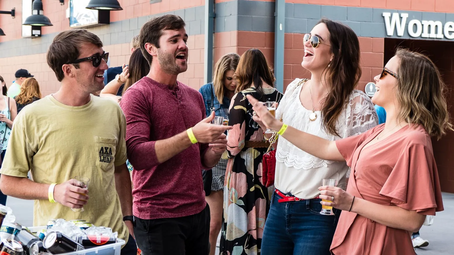Guests chatting over drinks at a concourse event