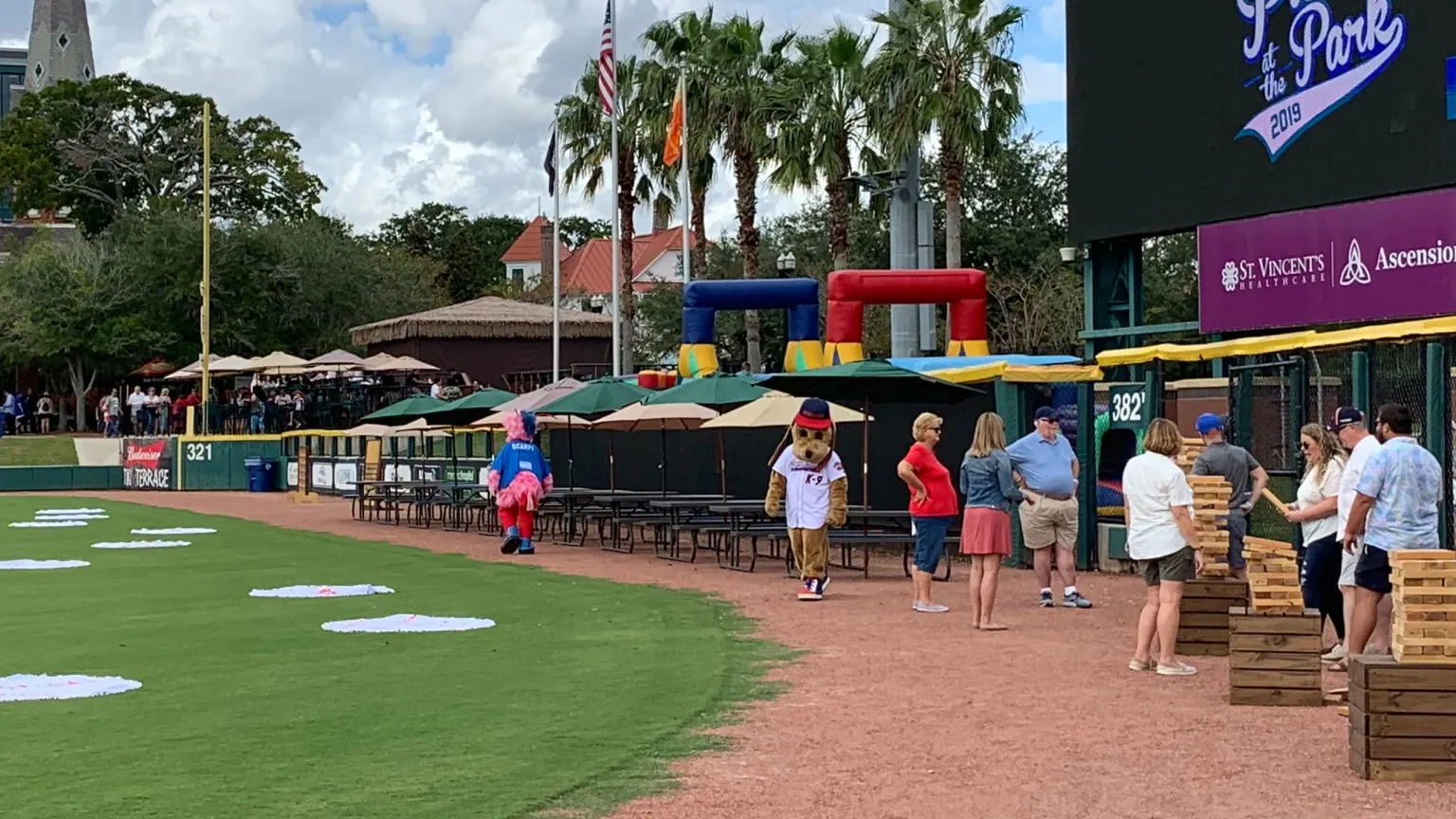Families enjoying games and activities on the field