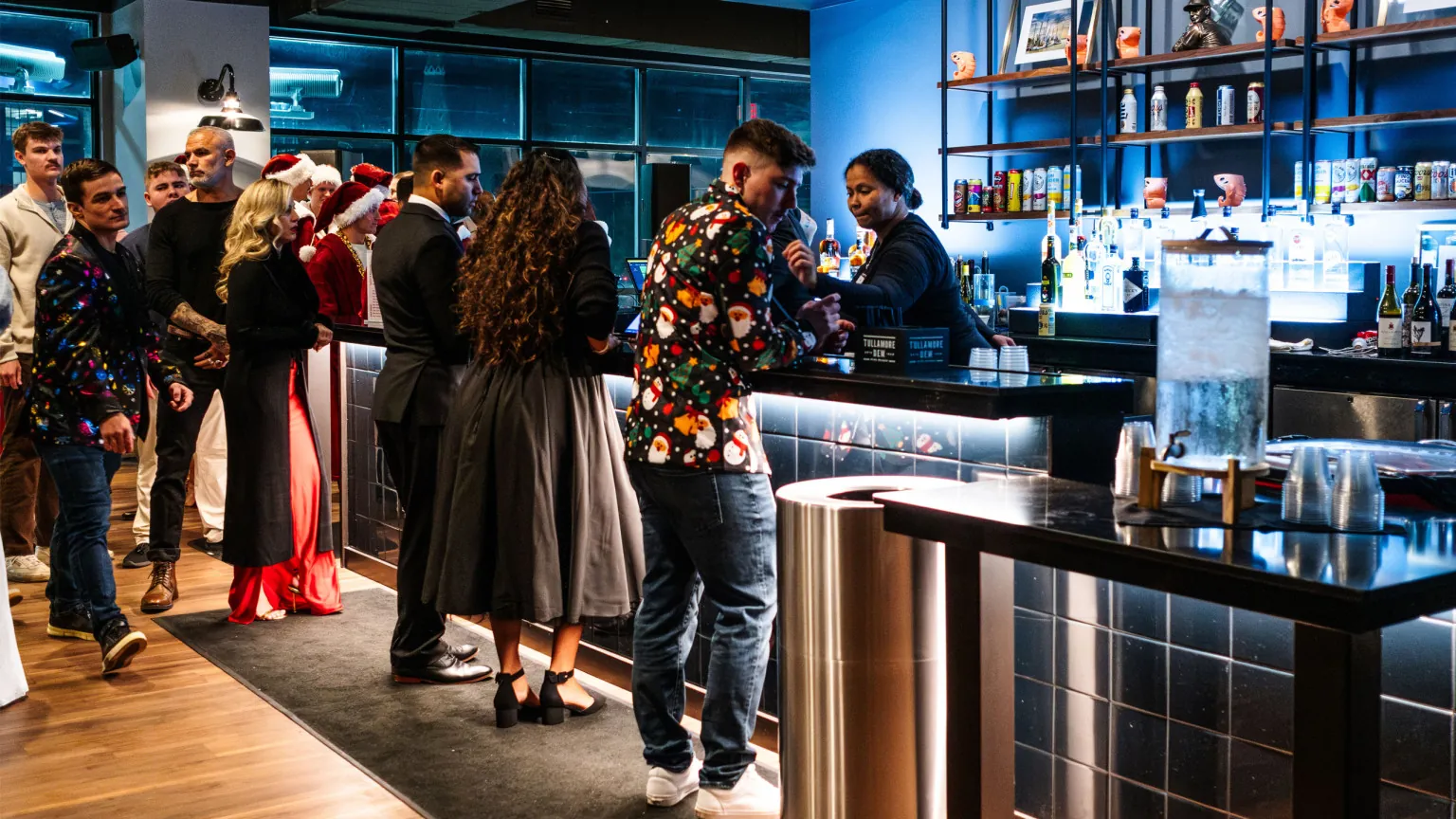 Guests gathered around the bar during a Harbour Hall event